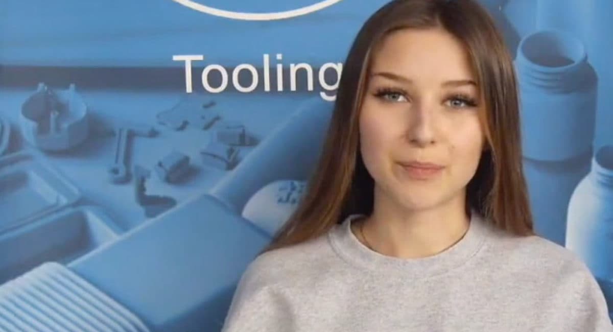 Inpress team member presenting in front of tooling displays